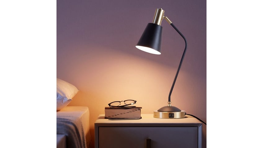Use the USBs on this lamp to charge your phone. 