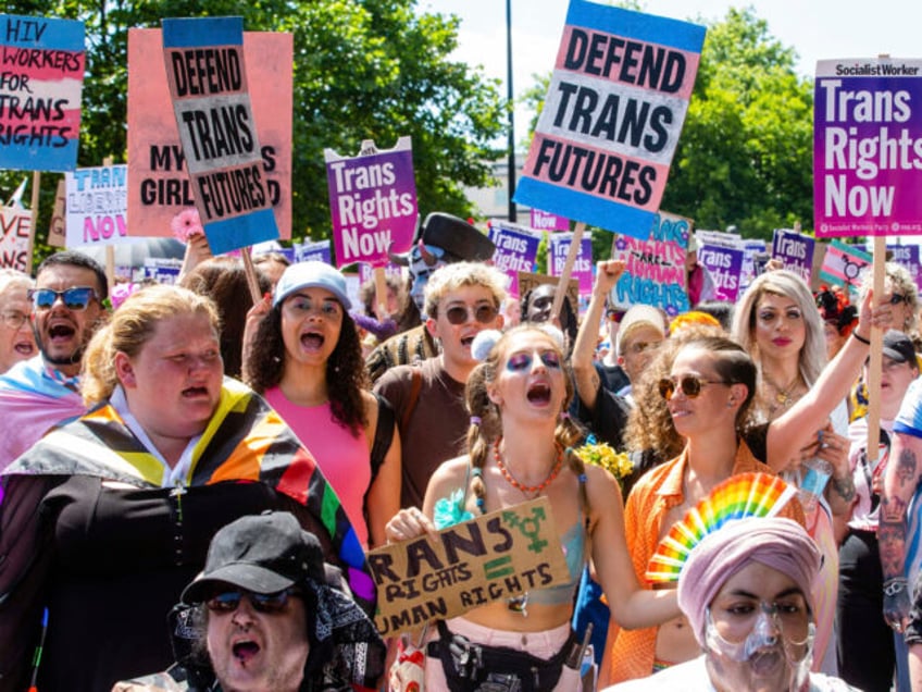 Thousands of people take part in a London Trans+ Pride march from the Wellington Arch to S