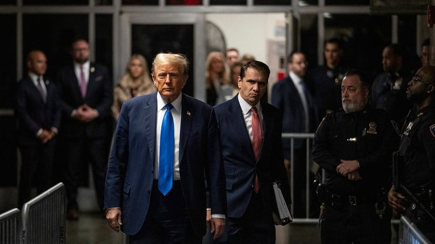 Donald Trump arrives to court on the first day of opening arguments in his trial at Manhattan Criminal Court