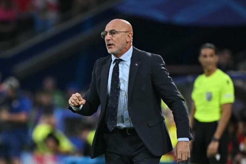 Luis de la Fuente reacts on the sidelines during Spain's 4-1 victory against Georgia at Eu