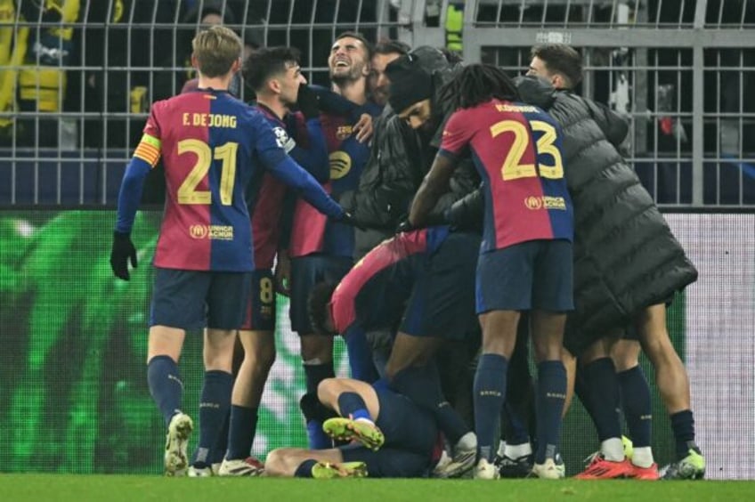 Barcelona celebrated a 3-2 win at Borussia Dortmund on Wednesday and are into the Champion