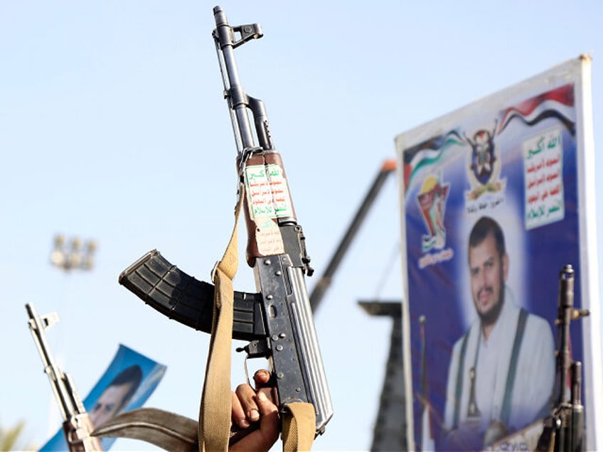 SANA'A, YEMEN - JANUARY 3: Yemen's Houthi supporters left weapons and placards depicting t