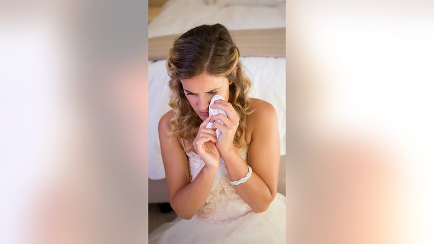 bride crying at wedding