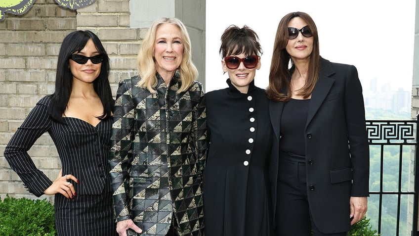 Jenna Ortega, Catherine O'Hara, Winona Ryder and Monica Bellucci posing together