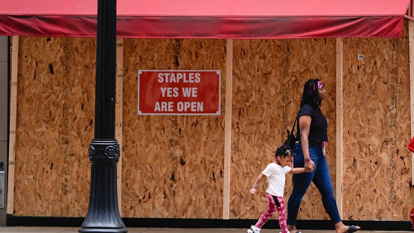 Boarded windows at Chicago businesses