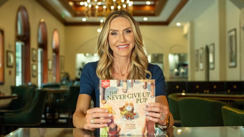 Lara Trump holding book