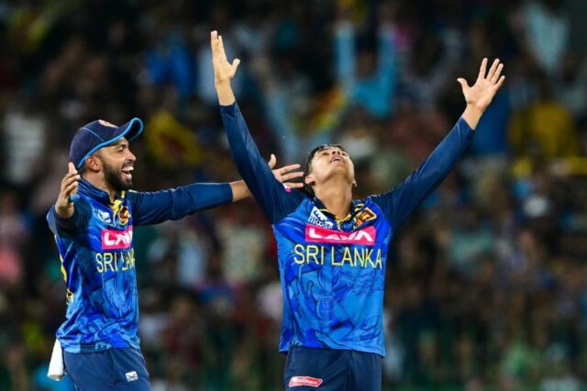 Sri Lanka's Dunith Wellalage and Sadeera Samarawickrama (L) celebrate their team's win in