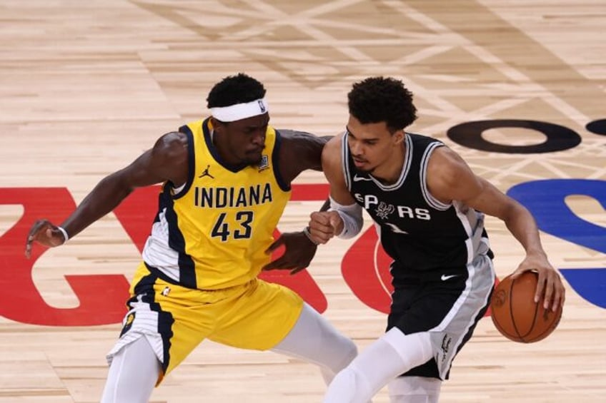 San Antonio's French star Victor Wembanyama, right, and Indiana's Cameroonian forward Pasc