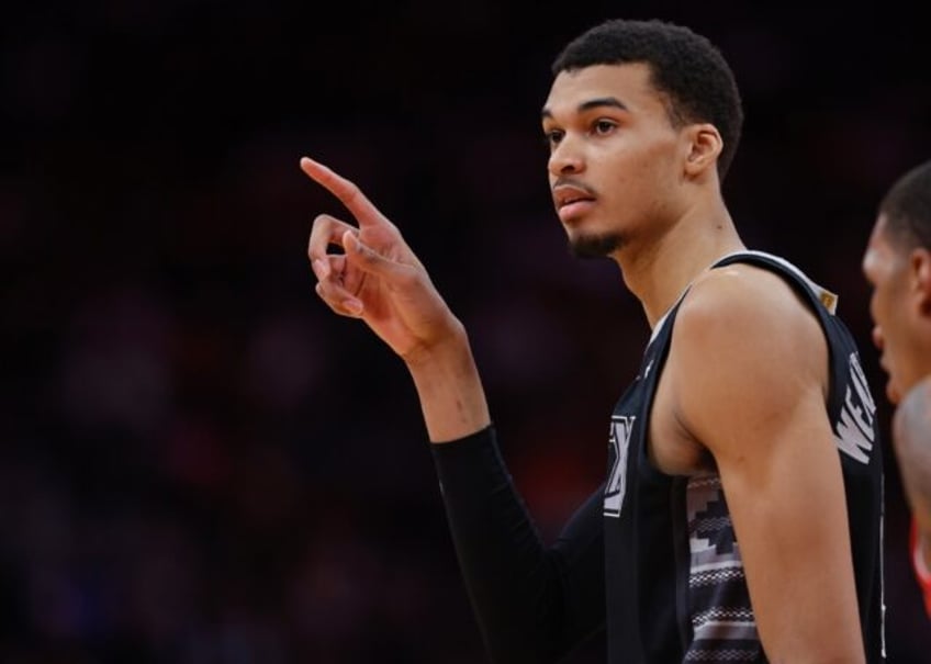 San Antonio Spurs rookie Victor Wembanyama reacts during an NBA game against the Houston Rockets