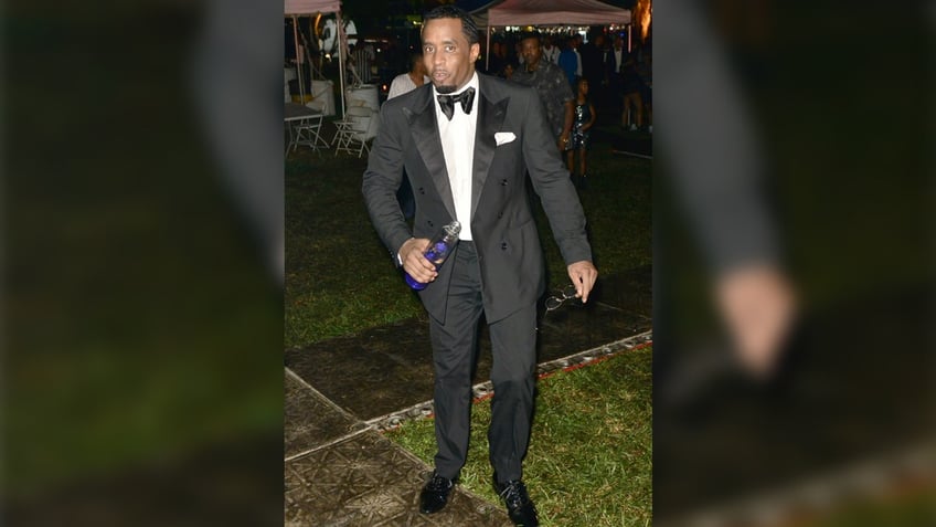 Sean Diddy Combs wears a tux at New Year's Eve party