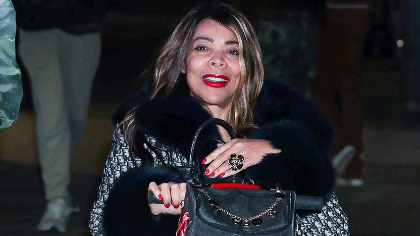 Wendy Williams wears blue Dior coat in New York.