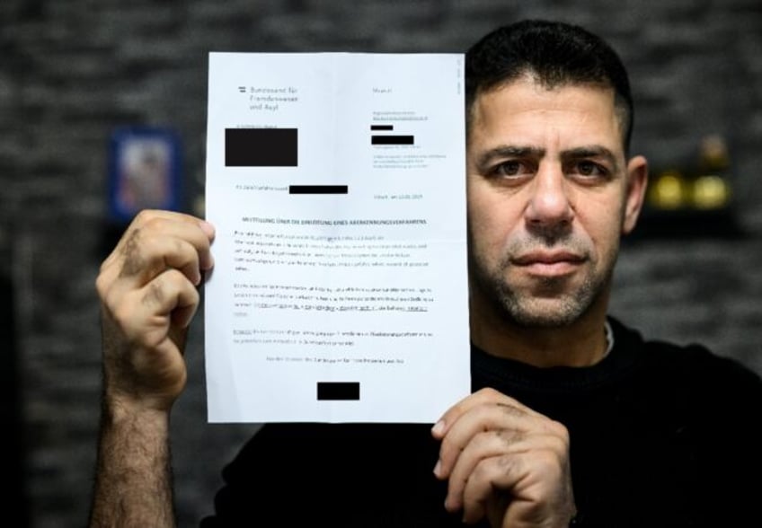 'What have we done?' Syrian refugee Khaled Alnomman with the letter threatening his family