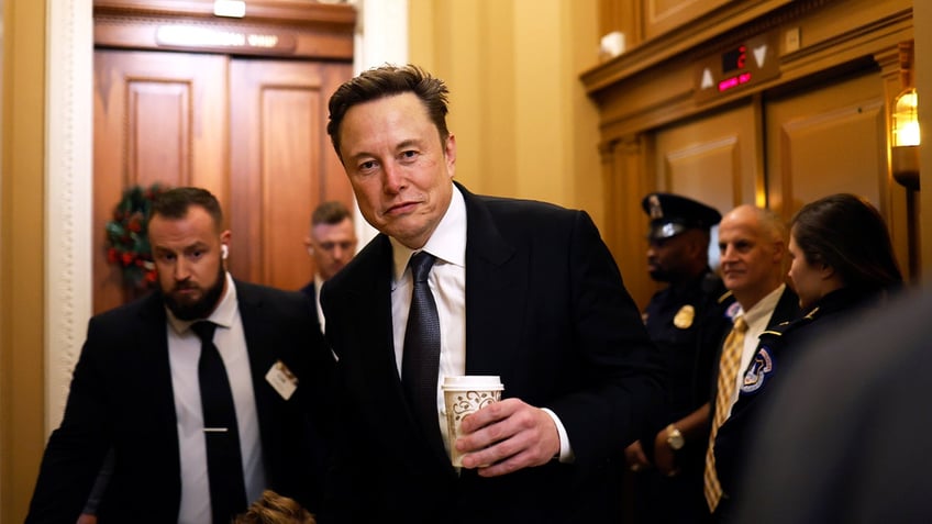 Tesla CEO Elon Musk, co-chair of the newly announced Department of Government Efficiency (DOGE), arrives on Capitol Hill with his son on Dec. 5, 2024 in Washington, DC.