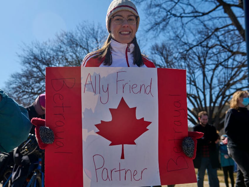 Natalie Wright, 33, of Ottawa, ON, Canada, joins a protest against the Trump administratio