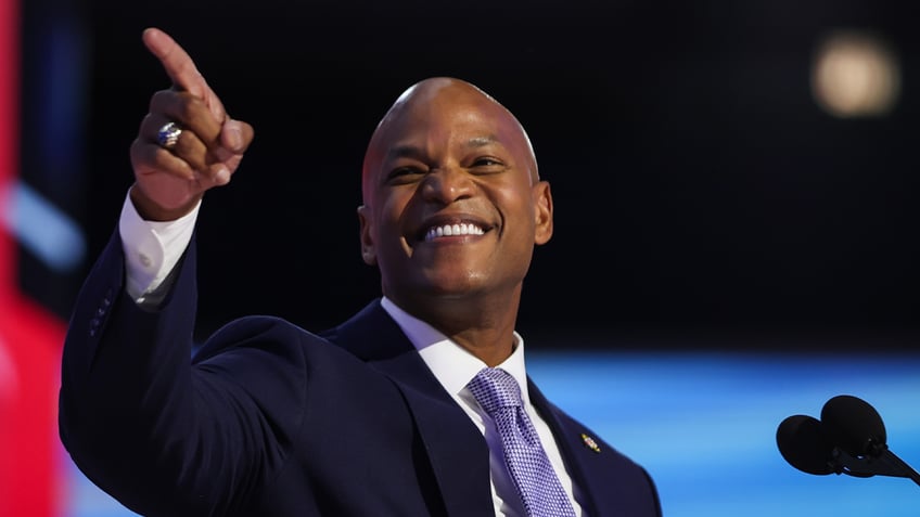 Wes Moore on DNC stage in closeup shot pointing with right hand