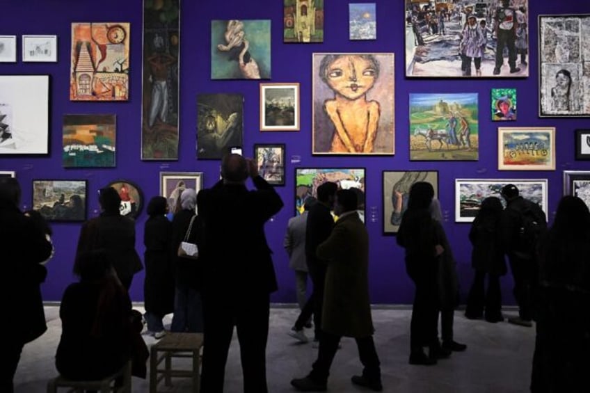 The Palestinian Museum's display features contemporary artworks alongside traditional cost