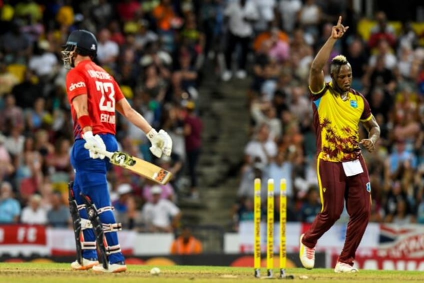 West Indies bowler Andre Russell celebrates the dismissal of Liam Livingstone in the first T20 international in Barbados on Tuesday