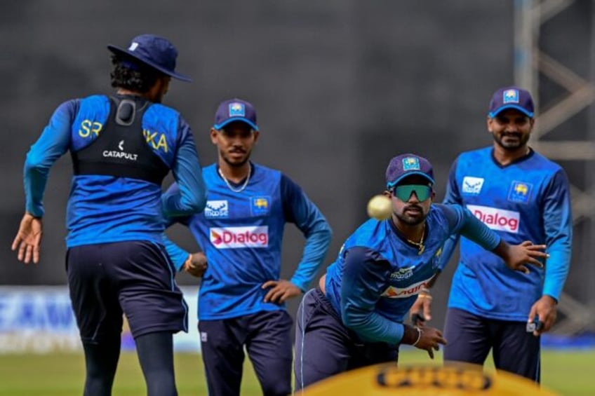 Sri Lanka's captain Charith Asalanka (2R) attends a practice session on the eve of the fir