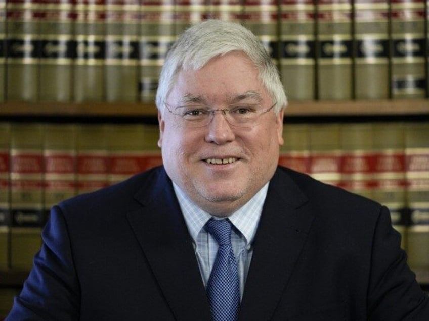 West Virginia Attorney General Patrick Morrisey speaks with reporters at the state Capitol