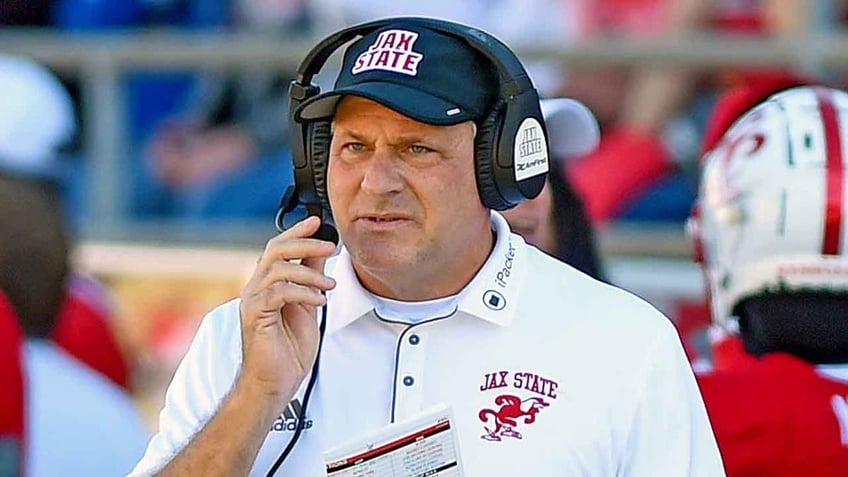 Rich Rodriguez looks on