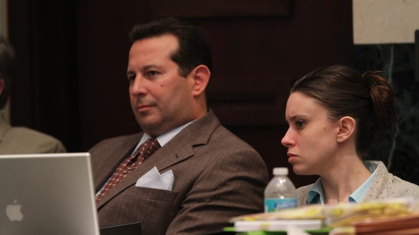 Attorney Jose Baez sits next to client casey Anthony in court