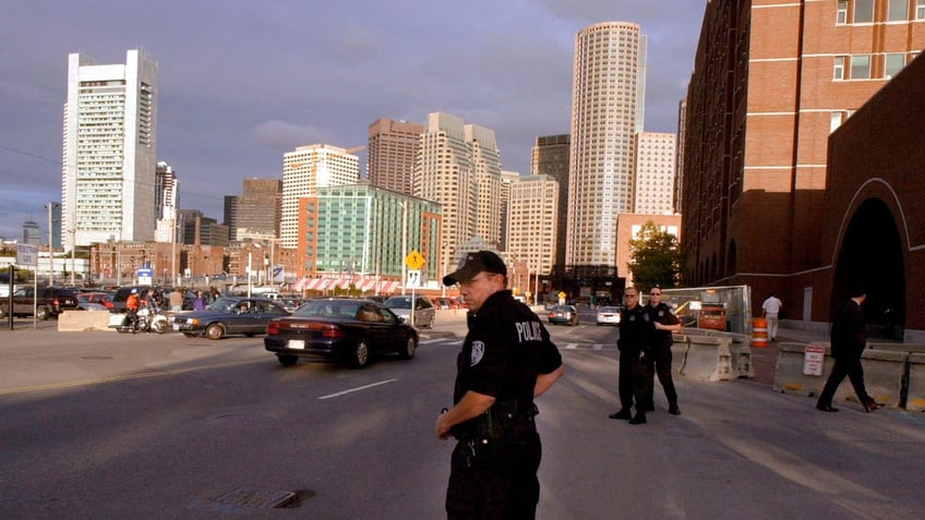 POLICE GUARD COURTHOUSE WHERE RICHARD REID PLED GUILTY.