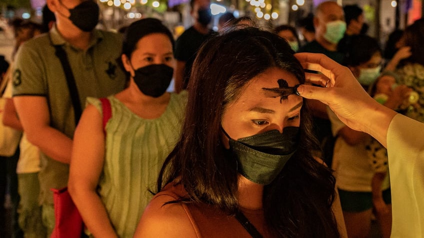 People in line to recieve ashes on Ash Wednesday