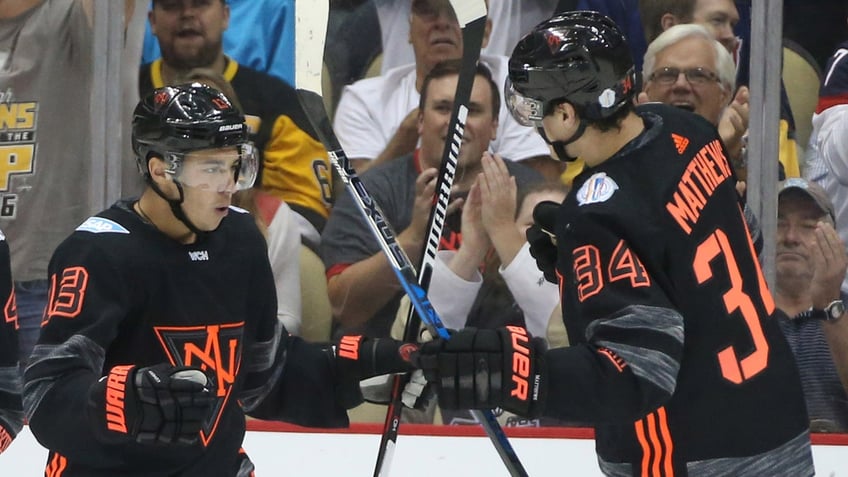 Team North America forward Johnny Gaudreu and Auston Matthews celebrate