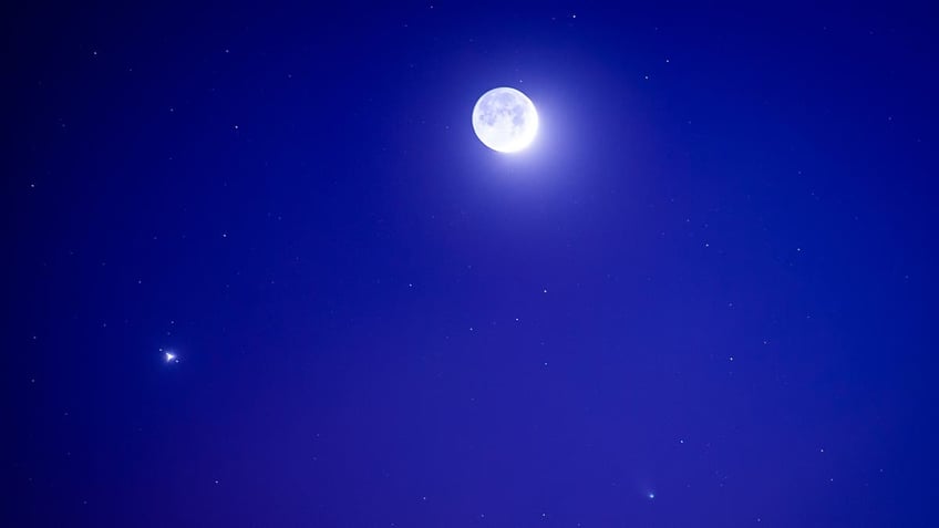 Devil comet, officially the 12P/Pons-Brooks Comet Next To Jupiter And The Moon