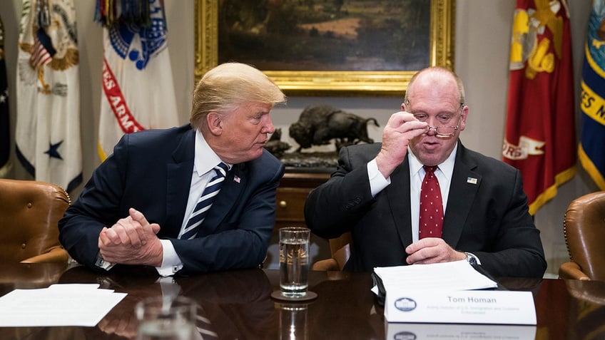 President Trump and Acting Director of Immigration and Customs Enforcement Thomas Homan talk during a law enforcement roundtable at the White House on March 20, 2018.