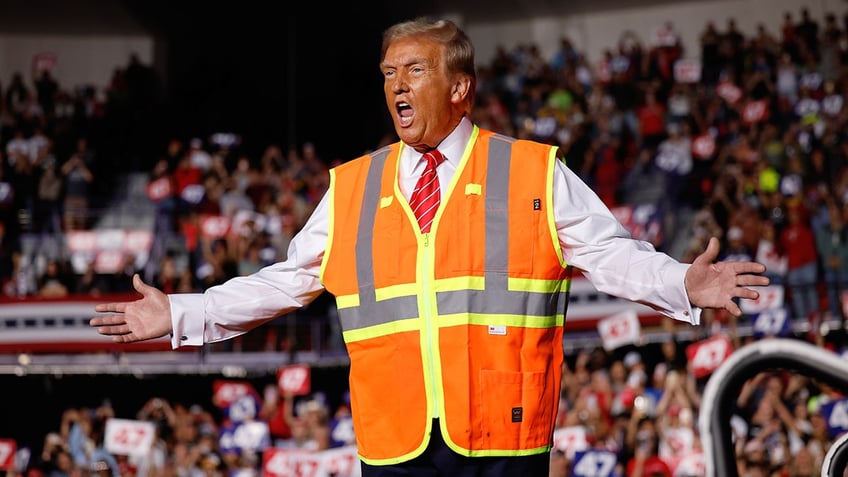 Donald Trump wearing an orange vest