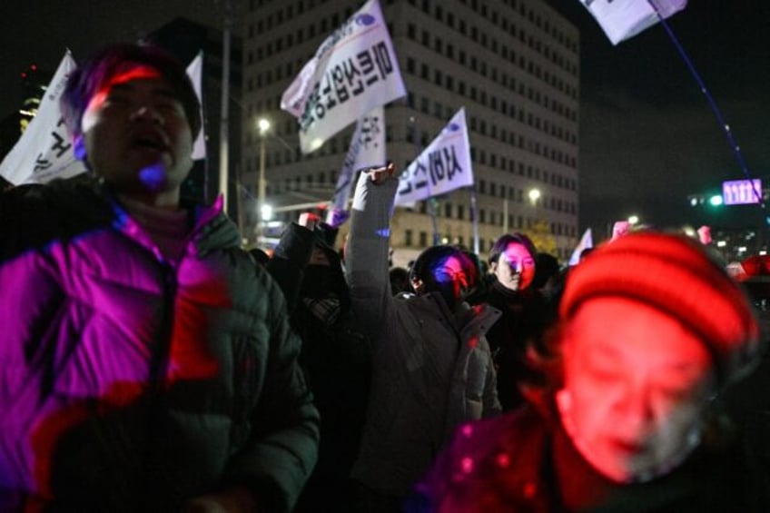 People gathered outside the National Assembly in Seoul after South Korean President Yoon S