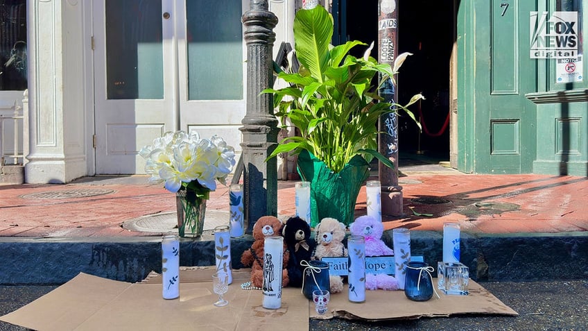 A memorial for those killed in the New Year’s Eve attack is left on Bourbon Street following the street’s reopening in New Orleans