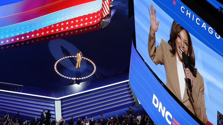 Kamala Harris on stage and in big screen on stage at the DNC