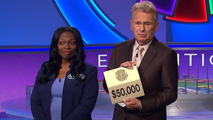 A photo of a "Wheel of Fortune" contestant seeing what prize she would have won.