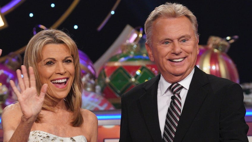 Vanna White and Pat Sajak smiling