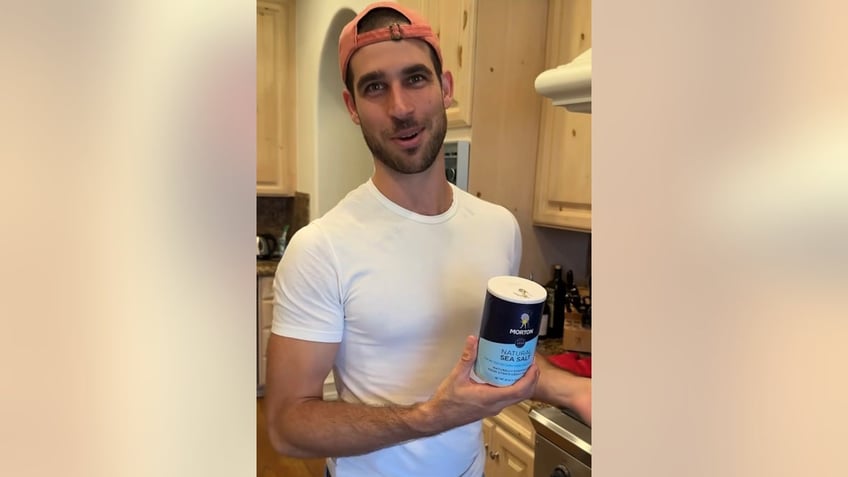 vanna white's son nikko holding a can of salt 