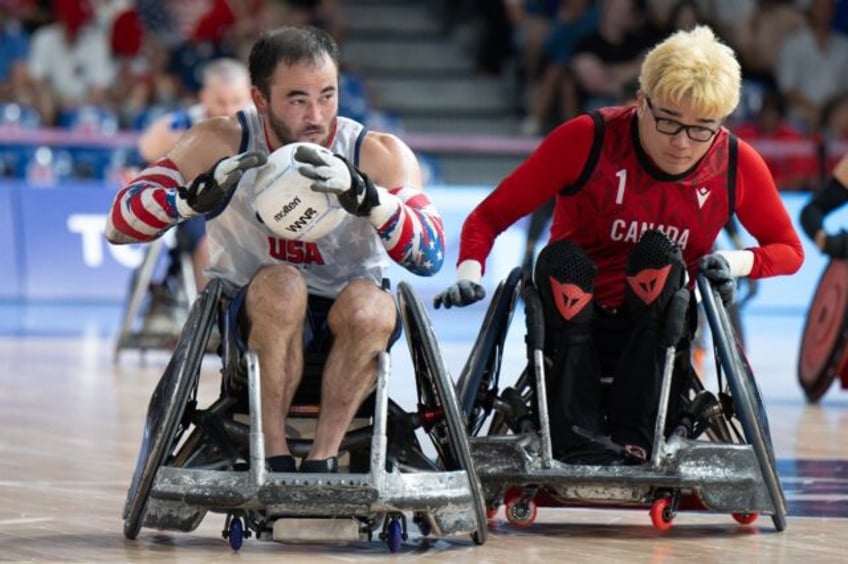 USA's Chuck Aoki (L) in action during the victory over Canada