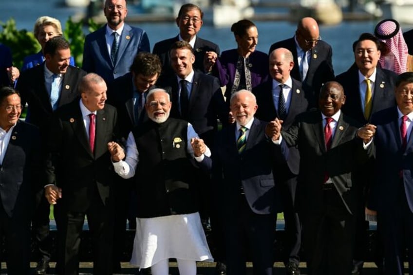 World leaders chatted and joked as they gathered to pose for a photo at the G20 summit in