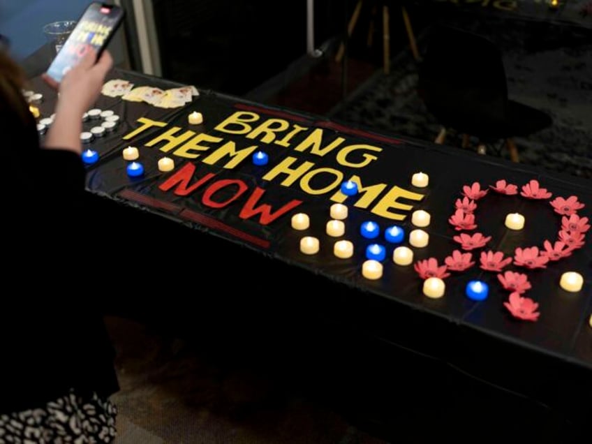 A message to bring home hostages still held by Hamas is spelled out on a table following a