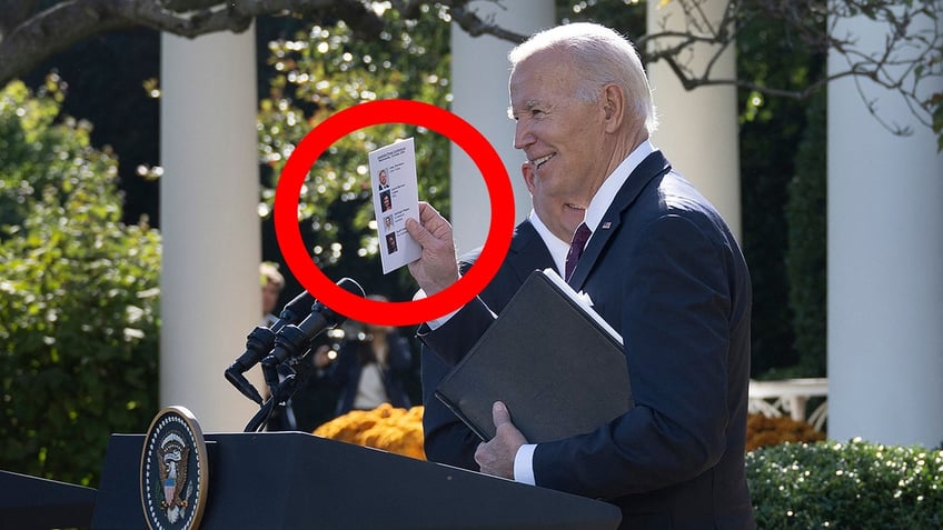 Biden holding a note card