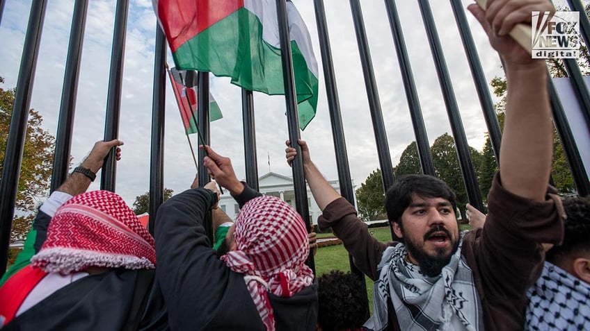 white house gates left defaced by graffiti from pro palestinian activists