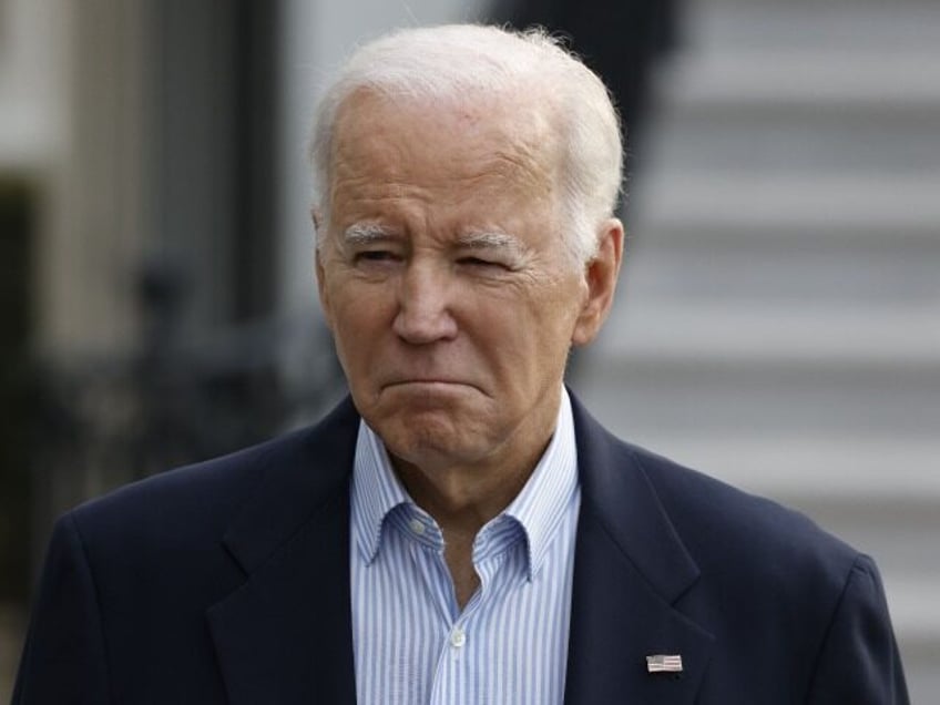 US President Joe Biden speaks to members of the media before boarding Marine One on the So