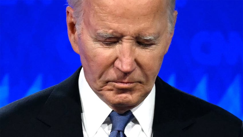 Joe Biden with head bowed