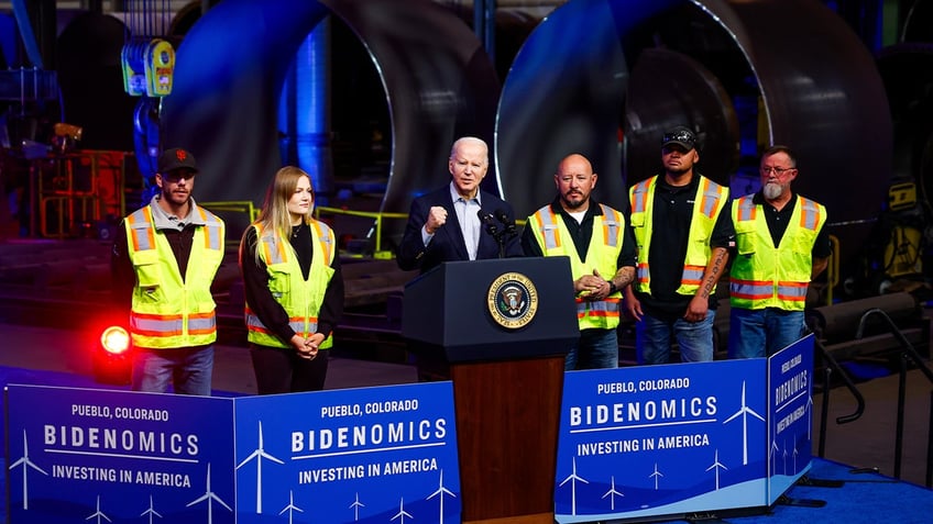 Standing next to CS Wind employees, US President Joe Biden speaks about Bidenomics at CS Wind on November 29, 2023 in Pueblo, Colorado. CS Wind, the largest wind turbine tower manufacturer in the world, recently announced they were expanding operations as a direct result of the Inflation Reduction Act.