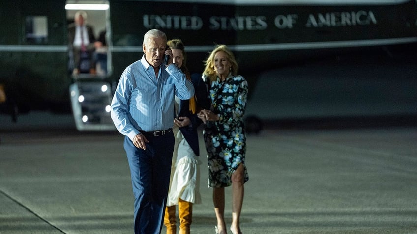 Biden on the phone walking to board Air Force One after debate