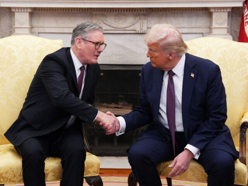 US President Donald Trump shakes hands with British Prime Minister Keir Starmer during a m