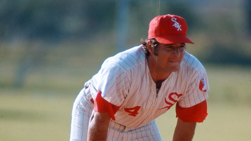 Bill Melton leans over on field