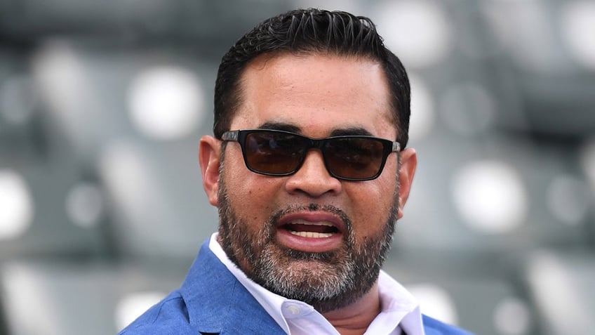 Ozzie Guillen looks on