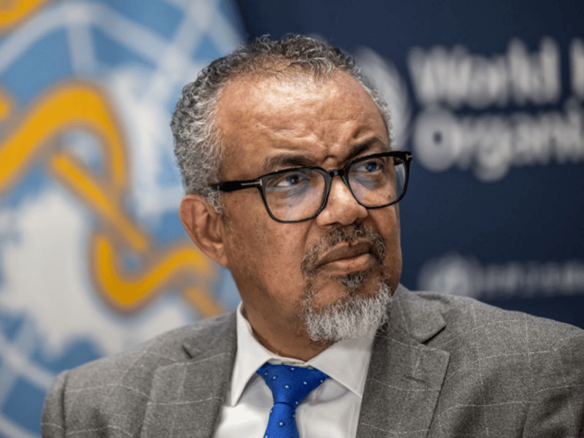 WHO Director-General Tedros Adhanom Ghebreyesus looks on during a press conference with th
